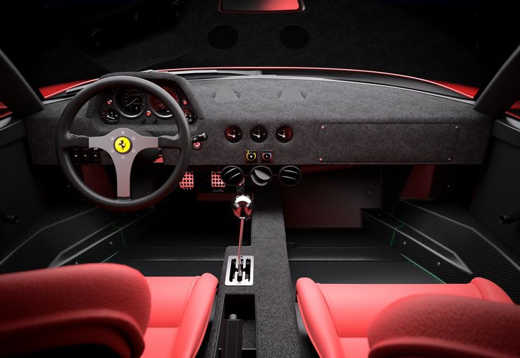 the interior of a ferrari sports car with red seats and steering wheel, shown from above