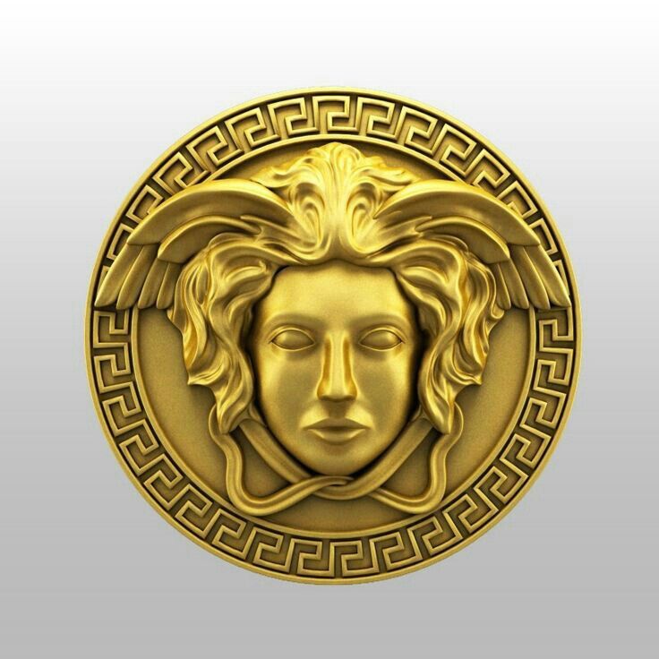 a golden medallion with a woman's face in the center