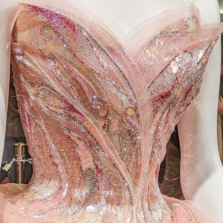 the back of a dress with sequins on it