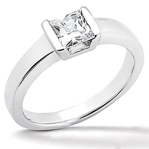 a white gold ring with a princess cut diamond