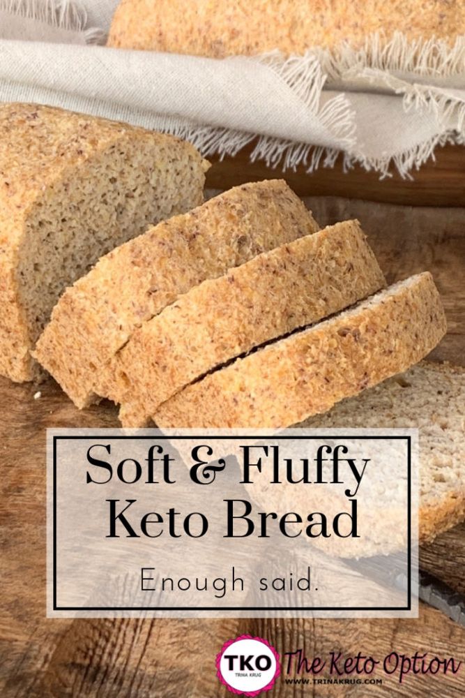 soft and fluffy keto bread on a cutting board with text overlay that reads, soft & fluffy keto bread enough to eat