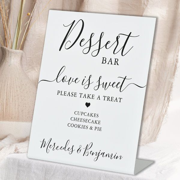 a sign that says dessert bar love is sweet please take a treat