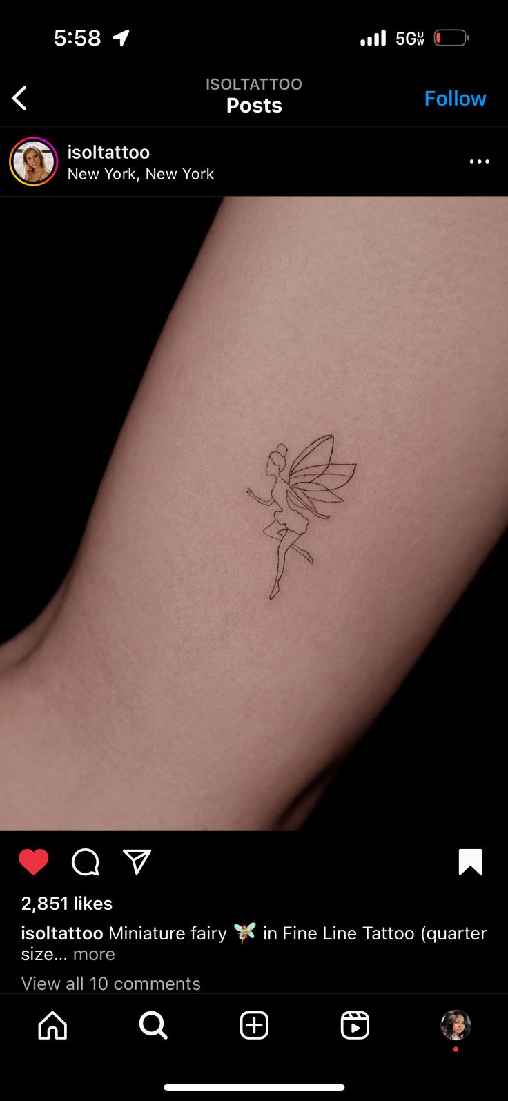 a small tattoo on the arm of a girl with a fairy tinkerbell in it