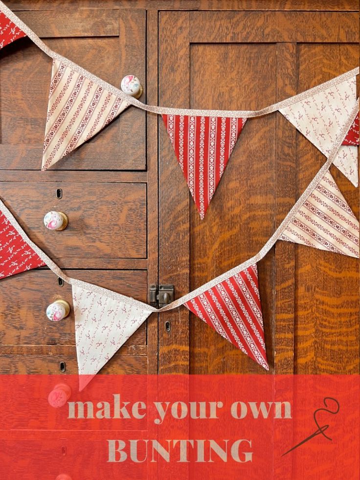 a wooden cabinet with red and white bunting on it