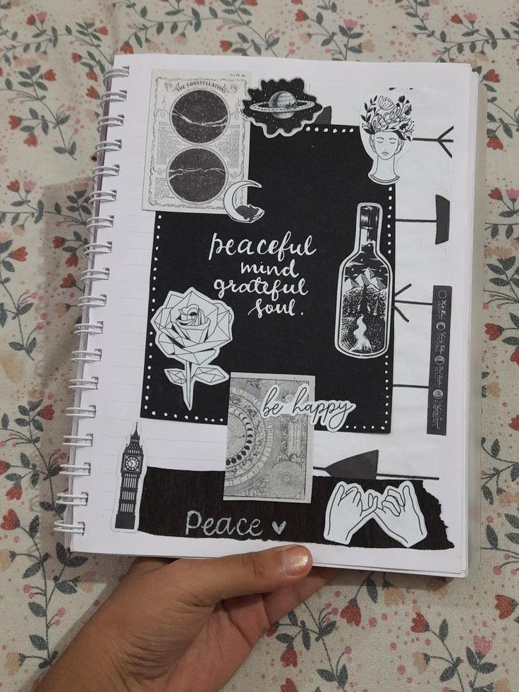 a hand holding up a notebook with stickers on it and the words peaceful mind, peace soul