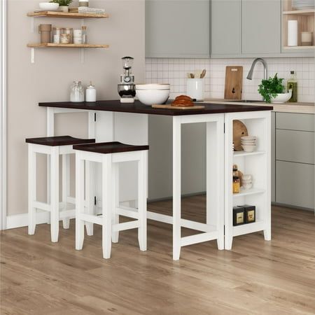 a kitchen island with three stools next to it