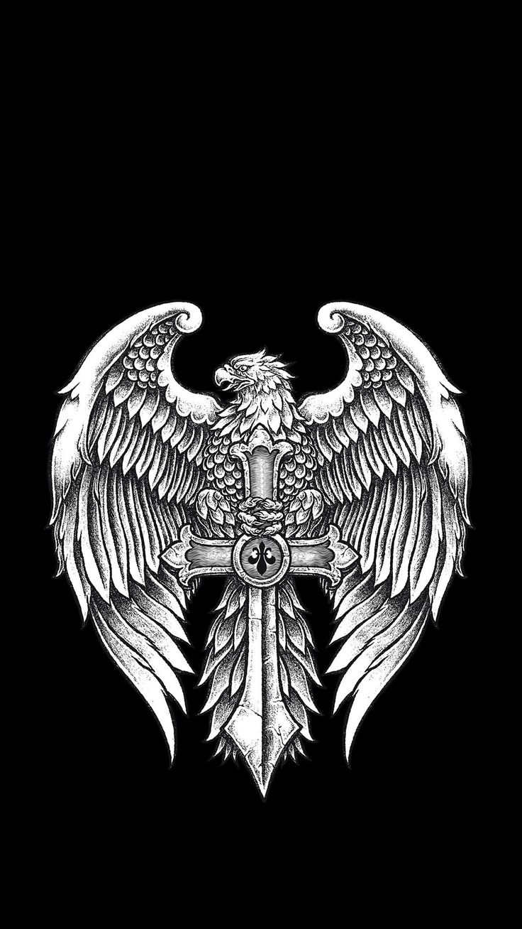 an eagle with wings on top of a cross