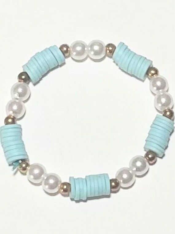 Baby Blue or light teal Bracelet  4$ Blue Bracelets Clay Beads, Mexico Bracelets Clay Beads, Aesthetic Homemade Bracelets, Teal Bracelet Ideas, Good Clay Bead Bracelet Ideas, Cute Blue Bracelet Ideas, Blue Bracelets Aesthetic, Cute Clay Bead Bracelet Ideas Winter, Light Blue Clay Bead Bracelet