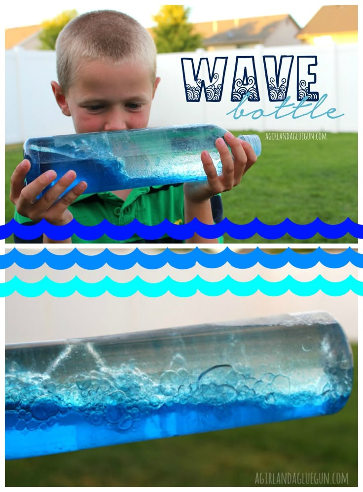 a young boy is playing with a water bottle