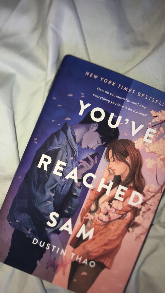 the book you've reached sam by dustin hao is laying on a bed