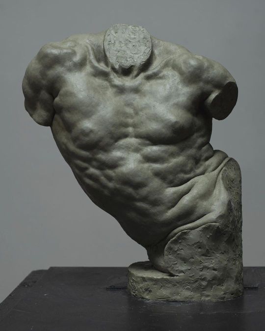 a sculpture of a man's back on a table