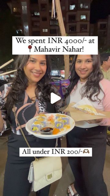 two women holding plates of food in front of a sign that says, we sport irr 400 / at f mahri naar