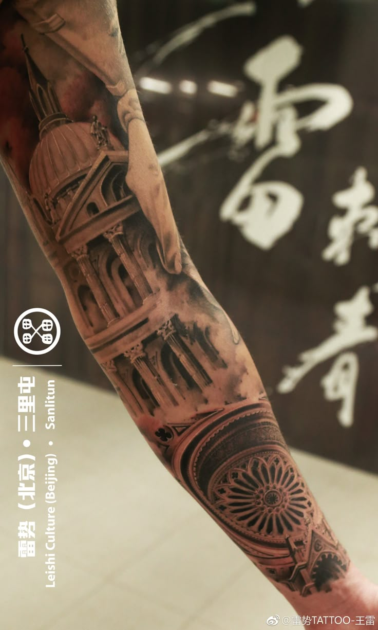 a man with a tattoo on his arm that has an image of a clock tower