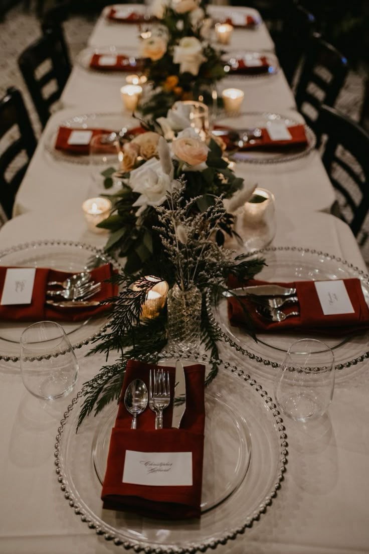 the table is set with place settings for dinner