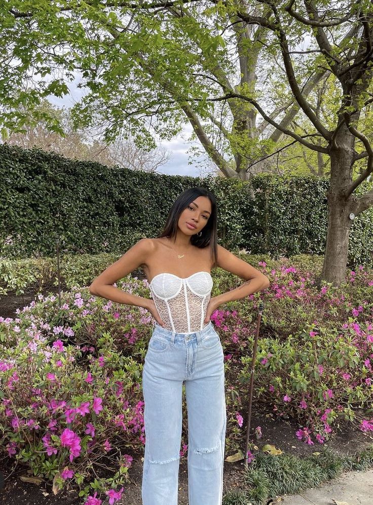 Nataly Lorenzo wearing BeginningBoutique white lace corset top and wide leg blue jeans Corset And Jeans Outfit, Corset Top And Jeans, White Corset Outfit, Corset With Jeans, White Lace Corset Top, White Top And Blue Jeans, Corset And Jeans, Corset Top Outfit, White Lace Corset