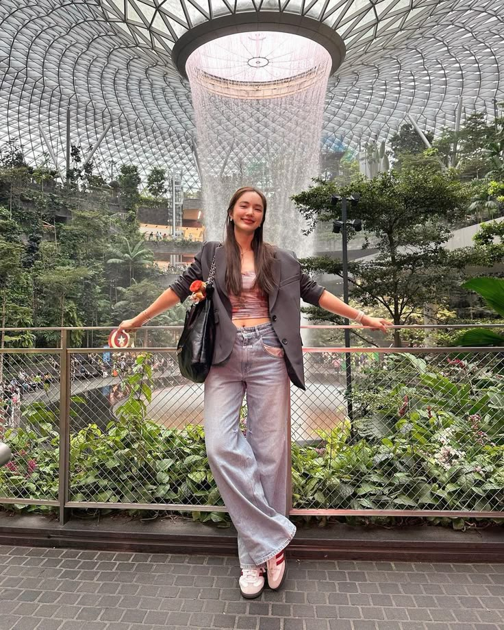 a woman standing in front of a building