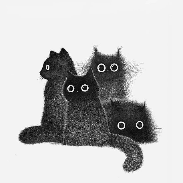 three black cats sitting next to each other