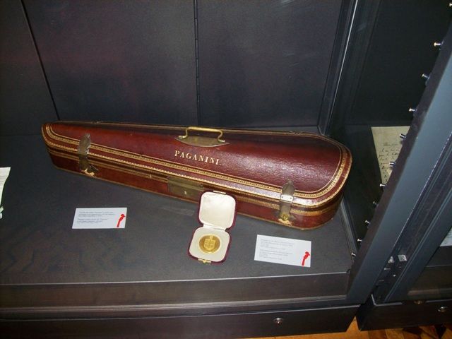 an old suitcase is on display in a case