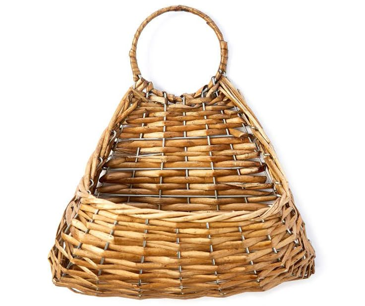 a wicker purse is shown against a white background