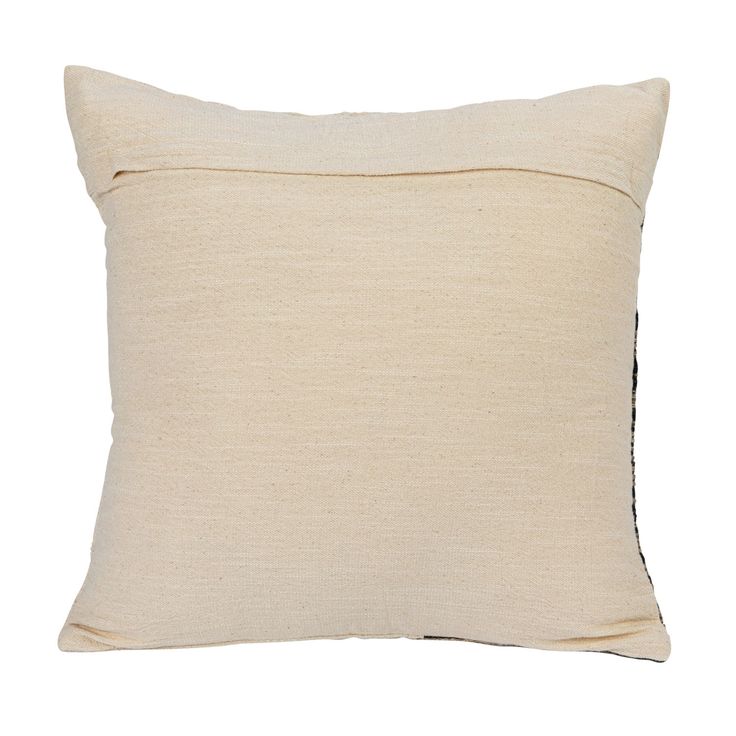 a white pillow with black piping on the front and back side, sitting against a white background