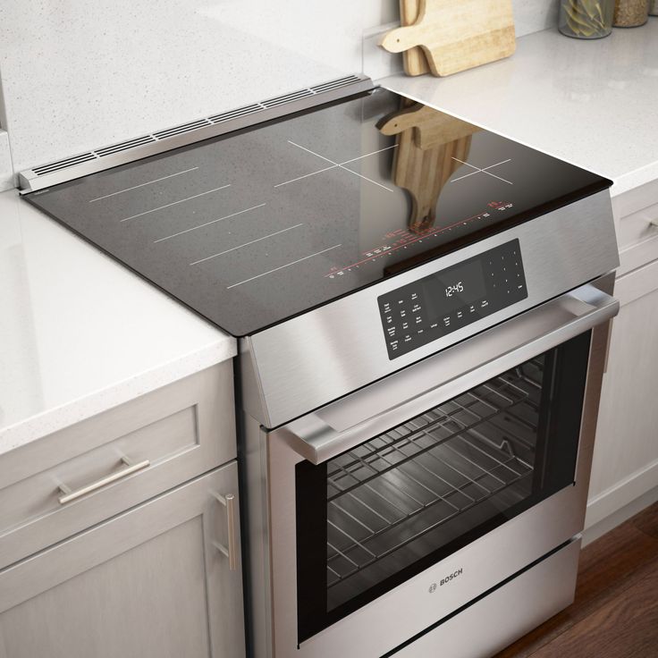 an oven with the door open in a kitchen