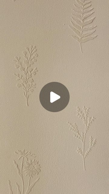 some plants are drawn on the wall with white paint