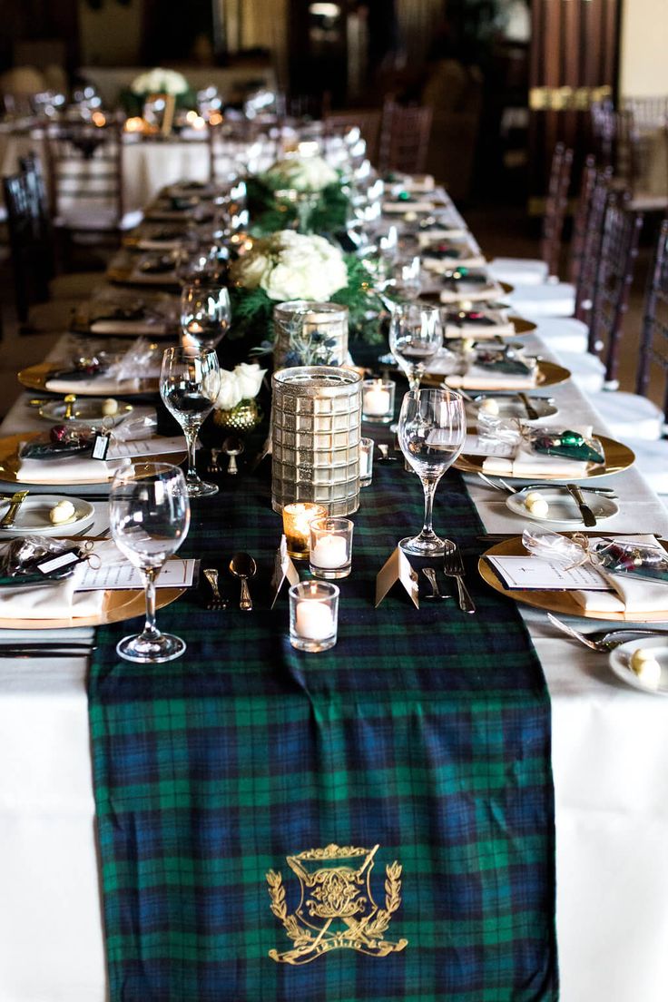 a long table is set with place settings and silverware for the guests to enjoy