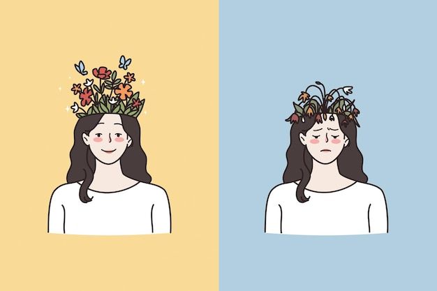 two women with flower crowns on their heads, one wearing a white shirt and the other blue