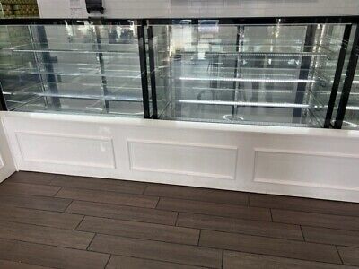 an empty glass display case in a store