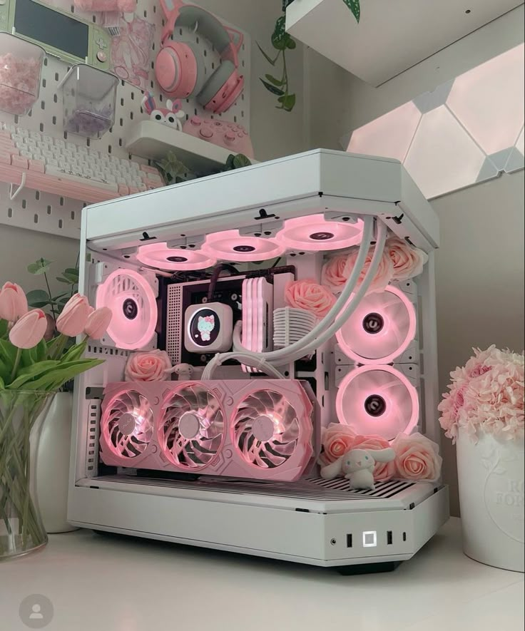 a white computer with pink flowers in the front and side panels on it's sides