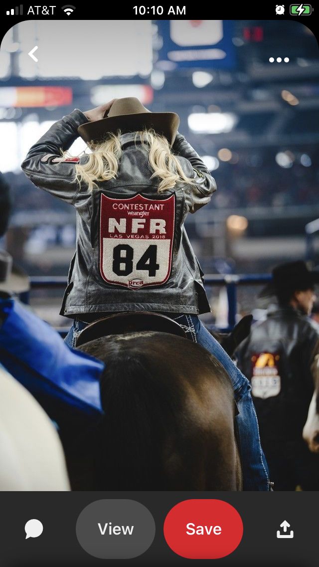 a woman riding on the back of a brown horse wearing a hat and leather jacket