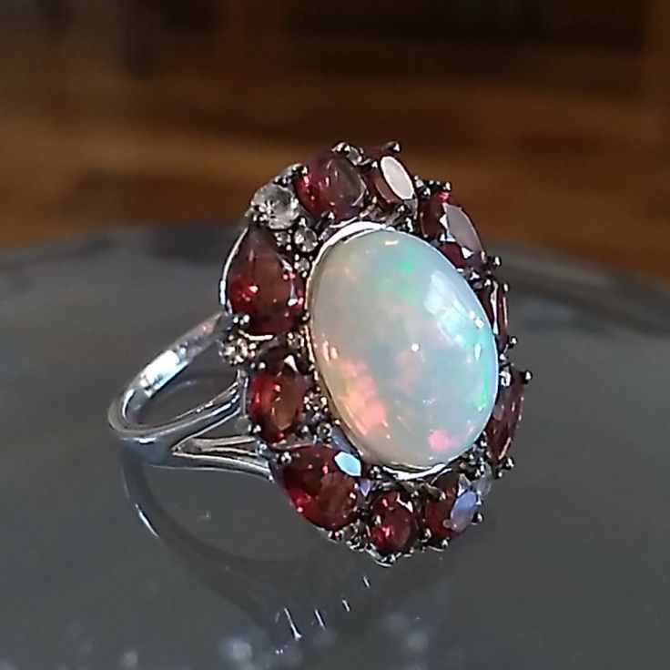 Rare Size 14 X 10 Mm Ethiopian Opal, Garnet And Topaz Sterling Ring Designed By Paul Deasy. 3.5 Carots Of Garnet.. Appraised $855!!!!! True Halo Affect Totally Natural. Never Worn!! Ruby And Opal Ring, Red Garnet Ring, Ring Color, Garnet Rings, Opal Ring, Red Garnet, Opal Rings, Womens Jewelry Rings, Ethiopian Opal