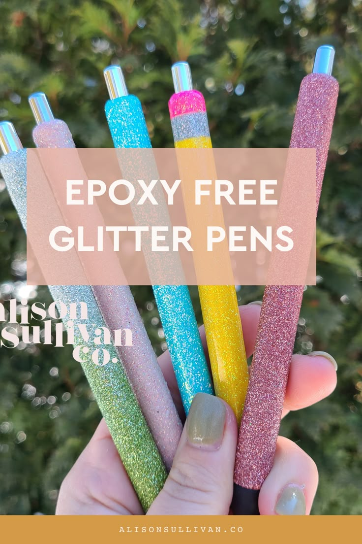 a person holding five glitter pens in their hand with the text epoxy free glitter pens