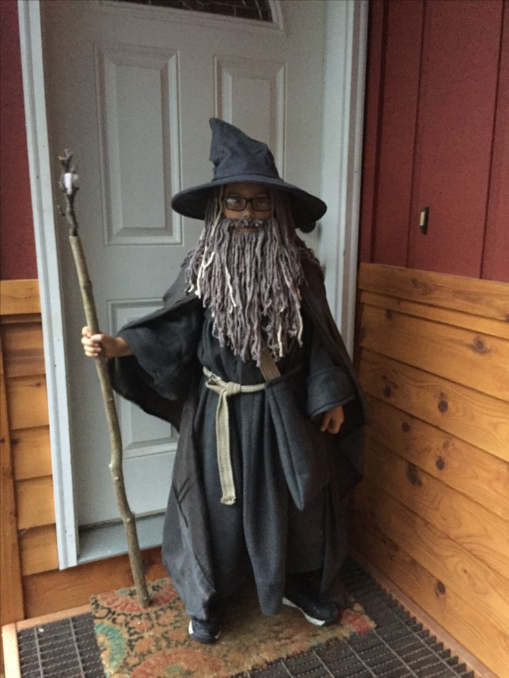 an old wizard is standing in front of the door