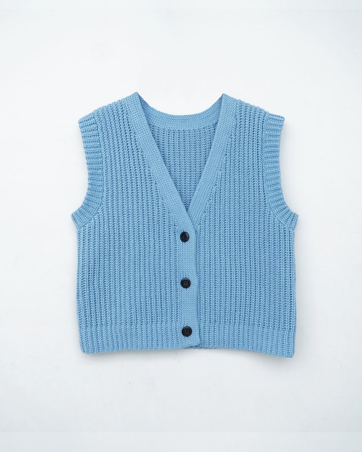 a blue sweater vest with buttons on the front and back, against a white background