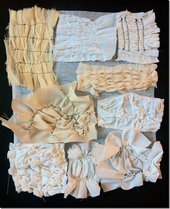 several pieces of white fabric with ruffles and beads on them are laid out together