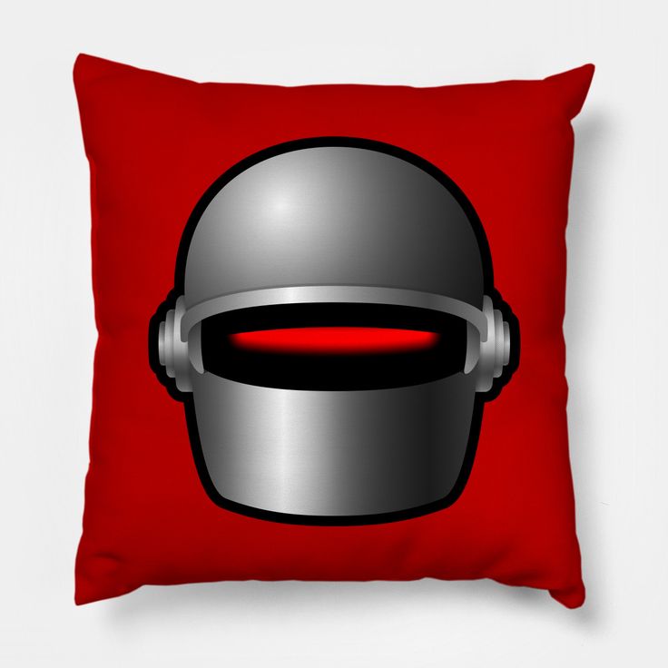 a red pillow with a silver helmet on it