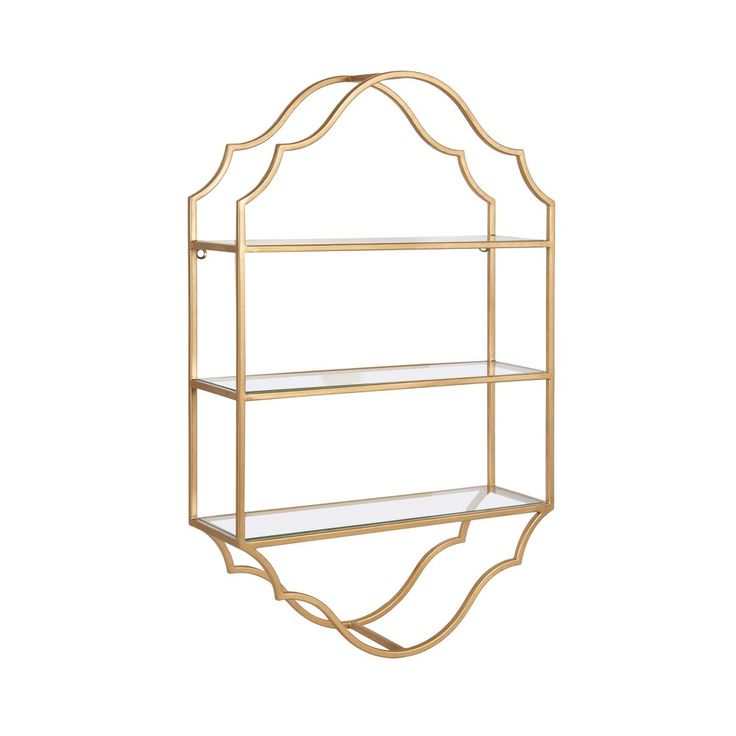 a gold metal shelf with glass shelves on the bottom and one shelf in the middle