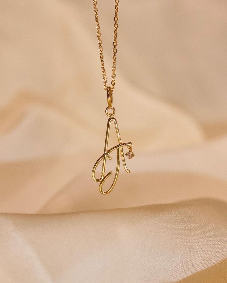 gold pendant set letter a Gold Letter Pendants, Gold Pendant Set, Hand Jewelry Rings, Couple Ring Design, Gold Bracelet Simple, Gold Initial Pendant, Locket Design, Jewelry Product Shots, Diy Beaded Rings