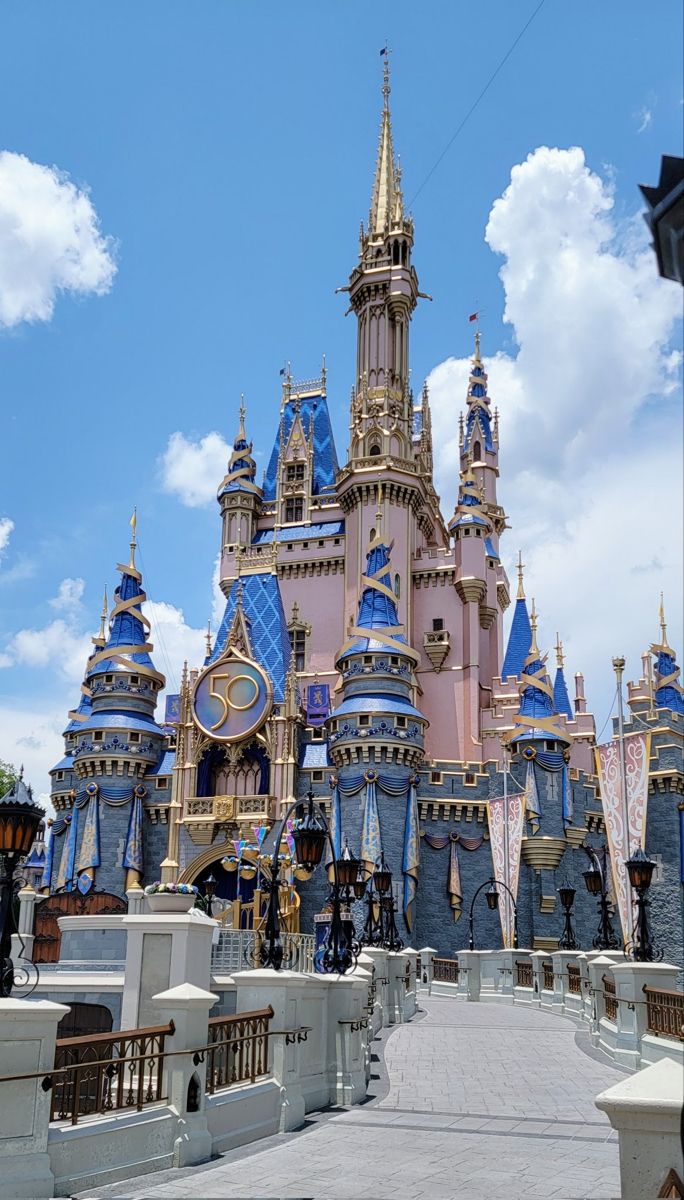 the castle is pink and blue with gold trim