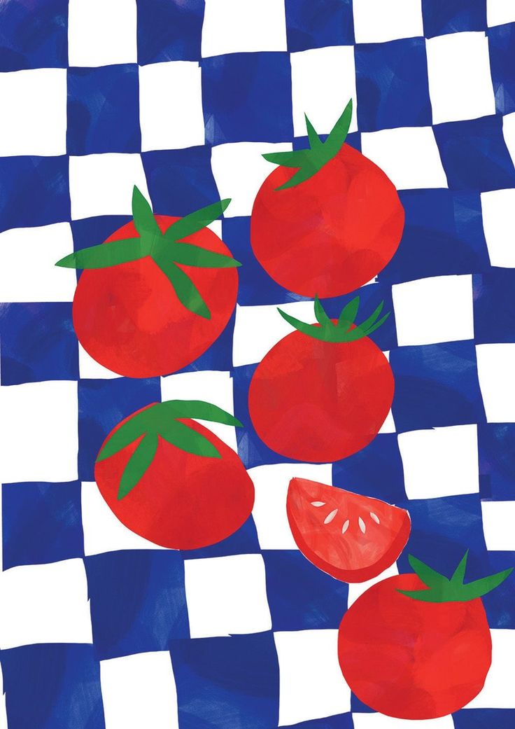 three tomatoes on a checkered table cloth