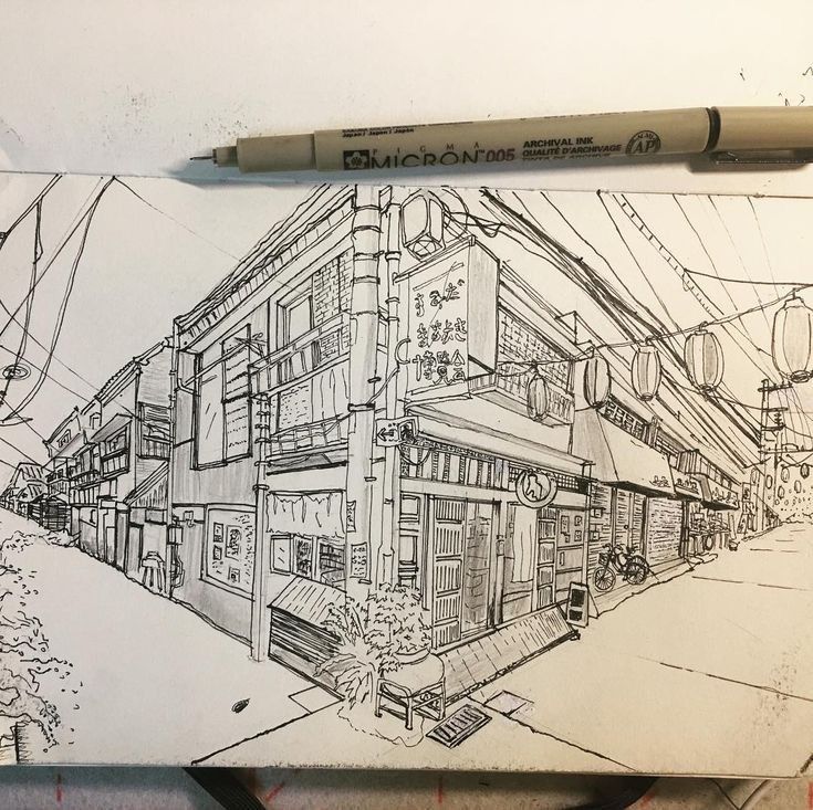 a pencil drawing of a building on the street