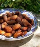 a blue and white bowl filled with nuts