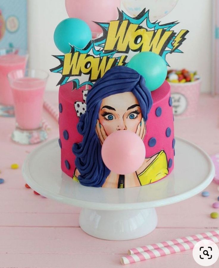 a birthday cake decorated with an image of a woman blowing a bubble on the top