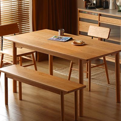 a wooden table with two benches next to it