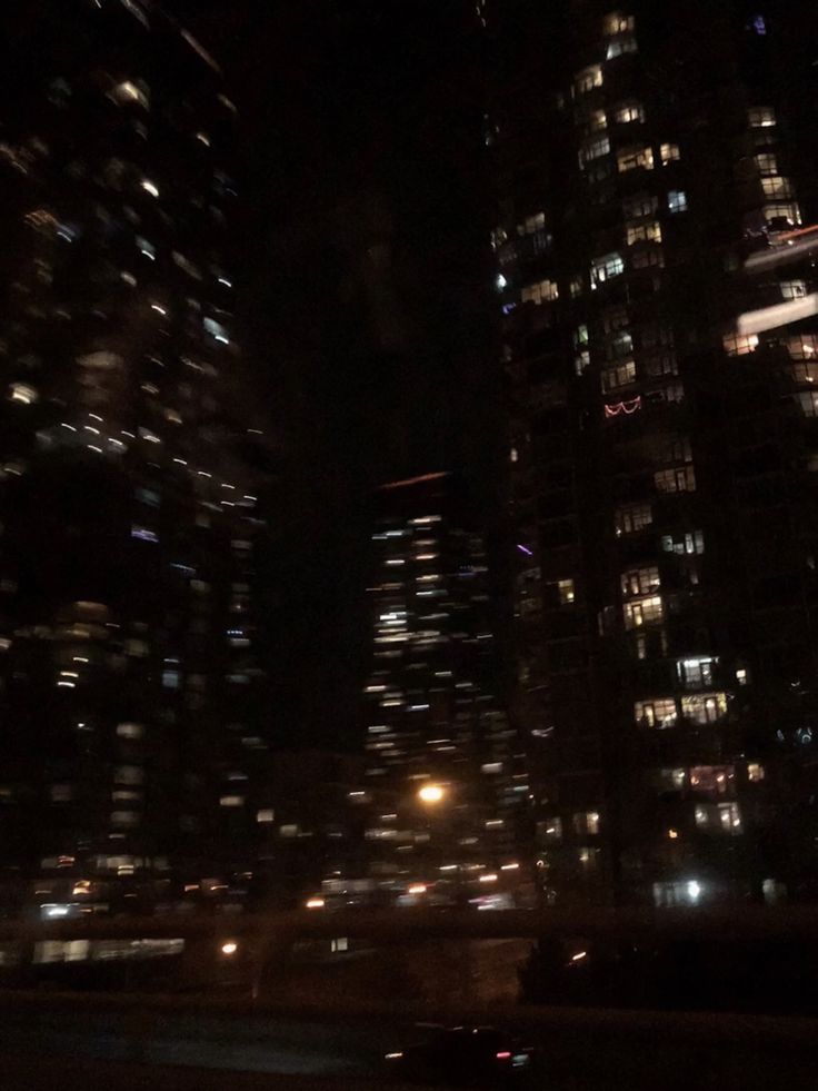 the city is lit up at night and it looks like they are going to die