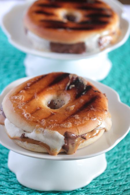 two donuts sitting on top of white plates