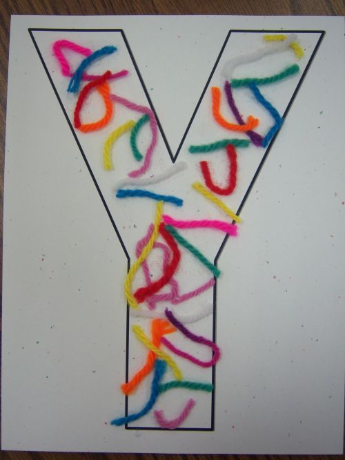 the letter y is made up of colored yarn and plastic straws on a white card