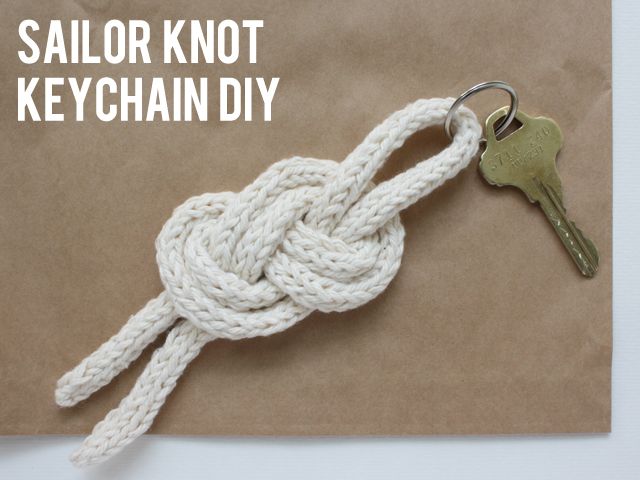 a keychain that is tied to a piece of paper with the words sailor knot on it