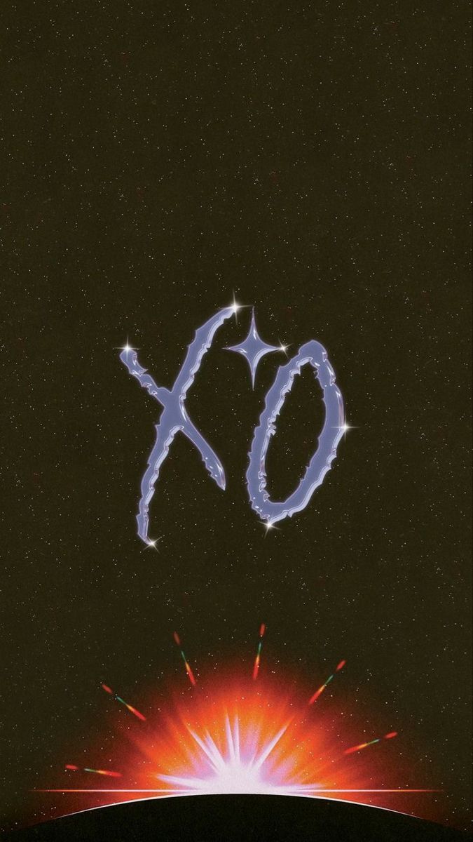 an xo logo is shown in the sky above a star filled field with fireworks